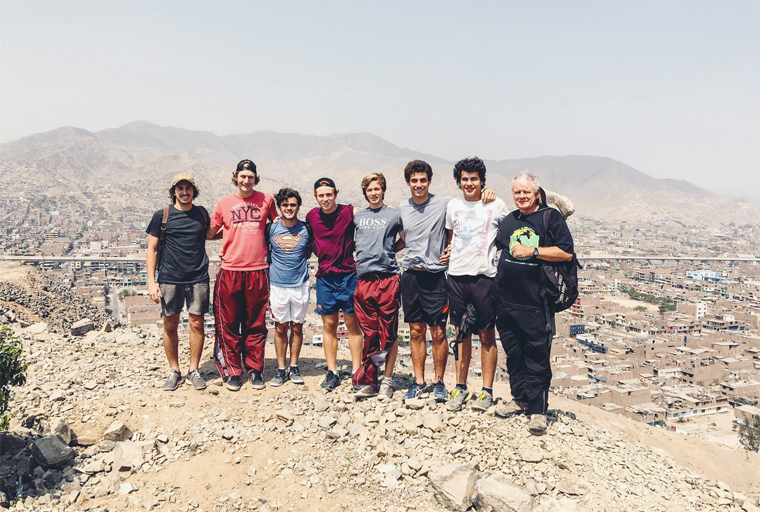 Brother Paul Keohane in 2015 on a hill of Canto Grande, with an immersion group of alumni from Cardinal Newman School of Buenos Aires.