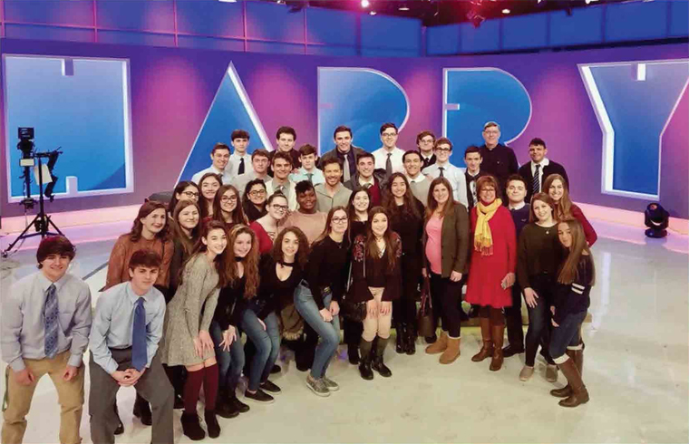 Harry Connick Jr., center, smiles for the camera on the set of