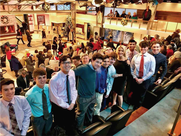 Megyn Kelly, fourth from right and Brother Paul Hannon, join students from
Monsignor Farrell High School on the set of