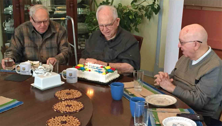 (l to r) Father Bill Brown, SJ, Br. Bert Darcy, Br. Raph Bellows
Preparing to cut the cake.