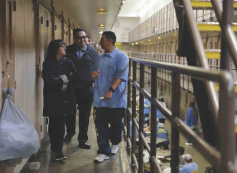 Palma staff members Tracy Jones (left) and Raul
Rico (center) are led on a tour of Soledad State
Prison during a reatreat the school community led at
the prison this year.