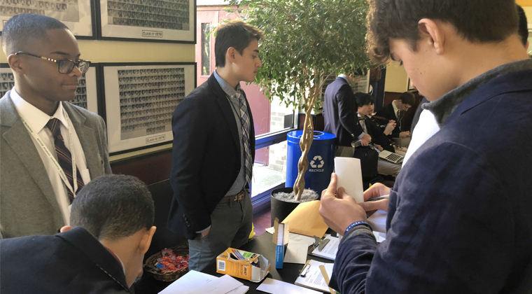 Members of Iona Prep’s Human Rights Club (including ACTION participant Jordon Gyapong (far left) collecting signatures for their letter writing campaign.