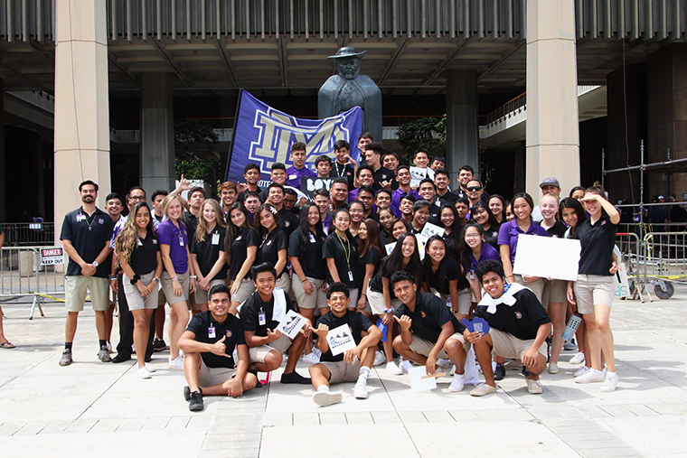 Damien students
and staff pose outside of the Capital during the
March Against Violence.