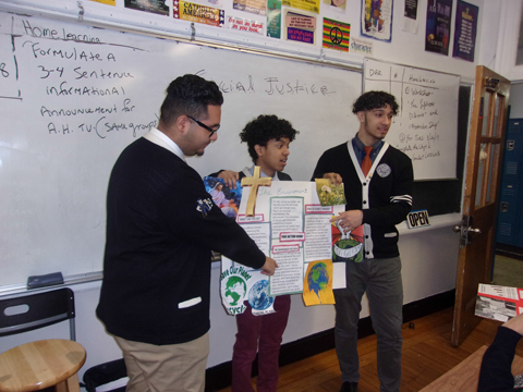 Senior students present to their peers regarding environmental concerns during their senior social justice class this spring.