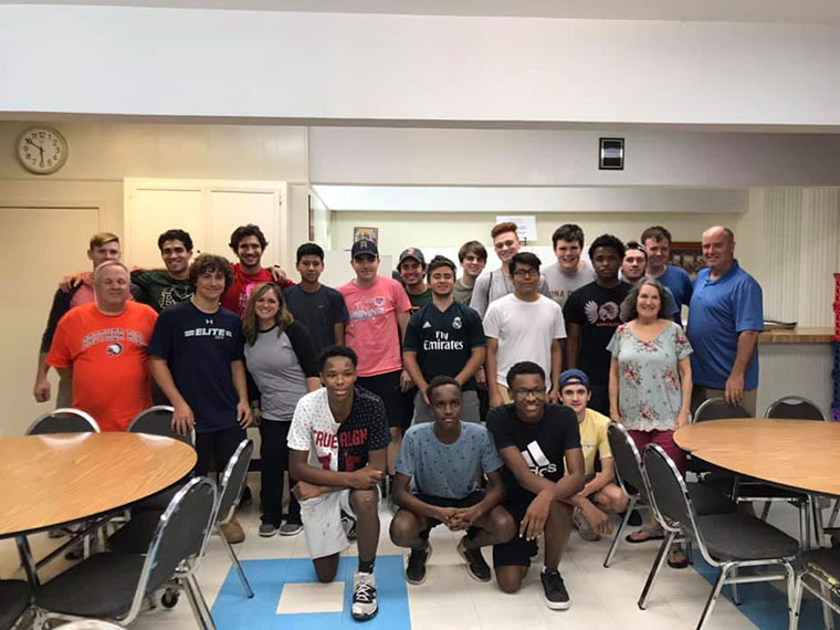 Students and staff members from Bishop Hendricken (RI), Brother Rice (MI), Catholic Memorial (MA) and Iona Prep (NY) pose for a group picture at Guadeloupe Regional Middle School during
the first week of the Brownsville immersion program. This group was the first of three that spent a week each learning about the realities of the immigration crisis that is occurring at the U.S.-Mexico border.